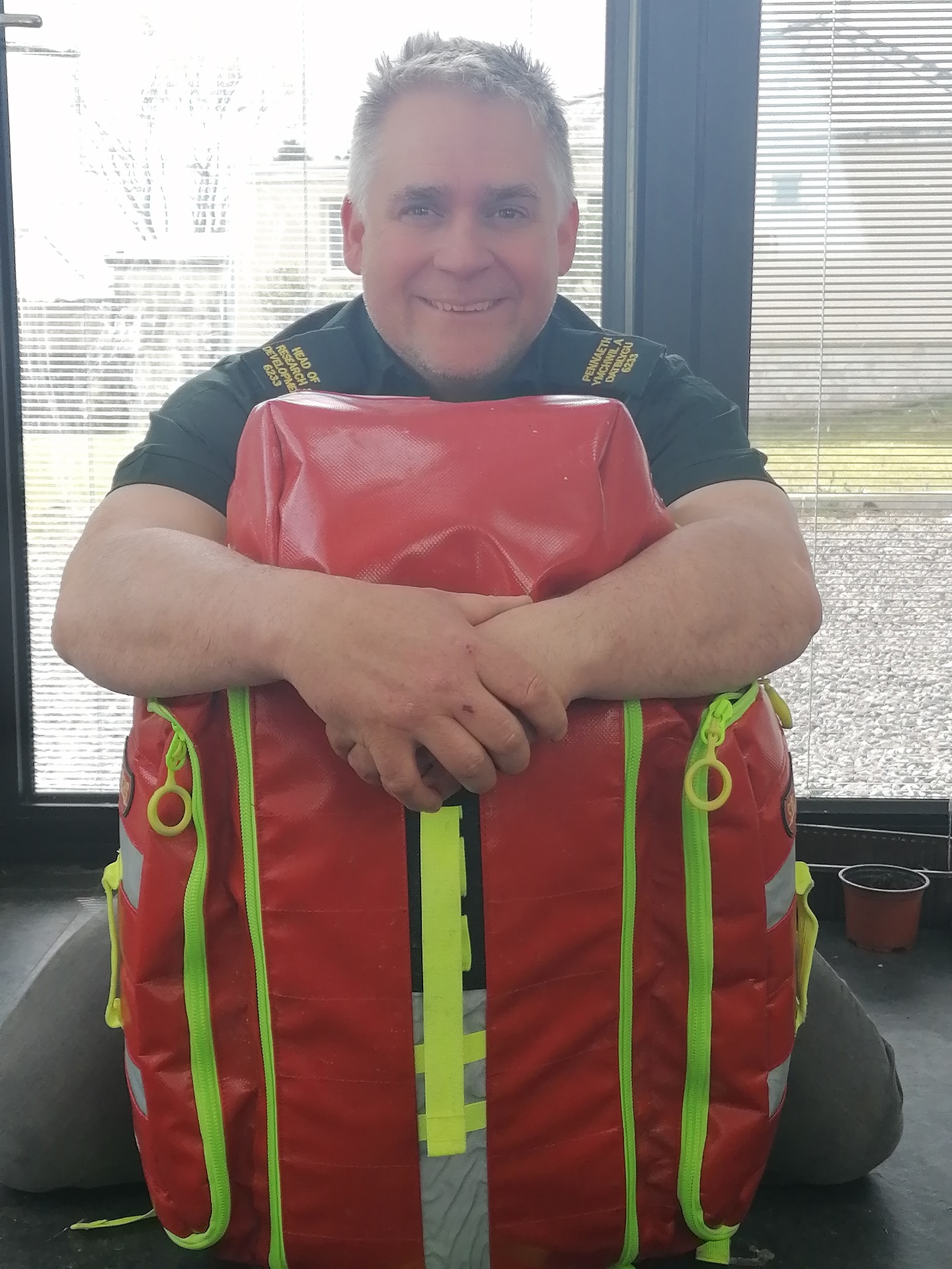 Nigel Rees, Head of Research and Delivery, Welsh Ambulance Service NHS Trust with his red kit bag