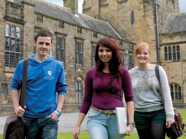 Three students on a university campus