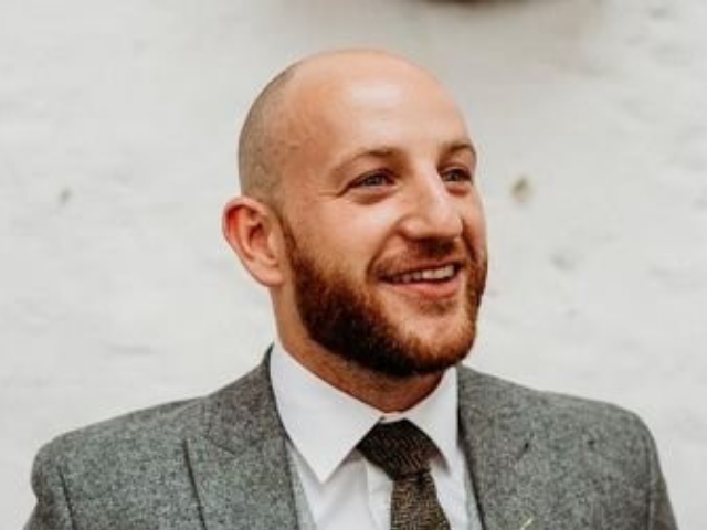 Man with beard wearing a suit