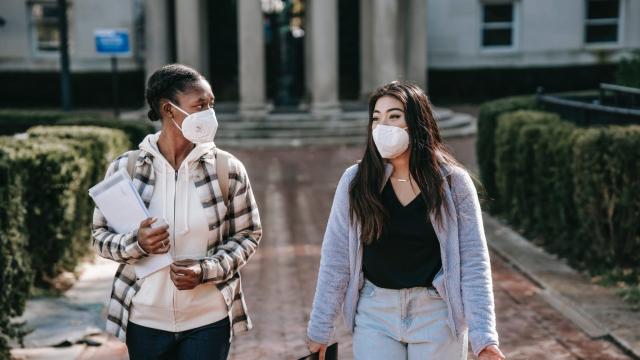 Two women walking and talking