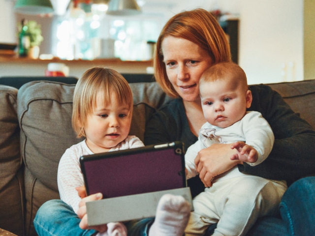 Mother and children with laptop