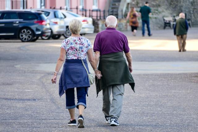 Older couple holding hands