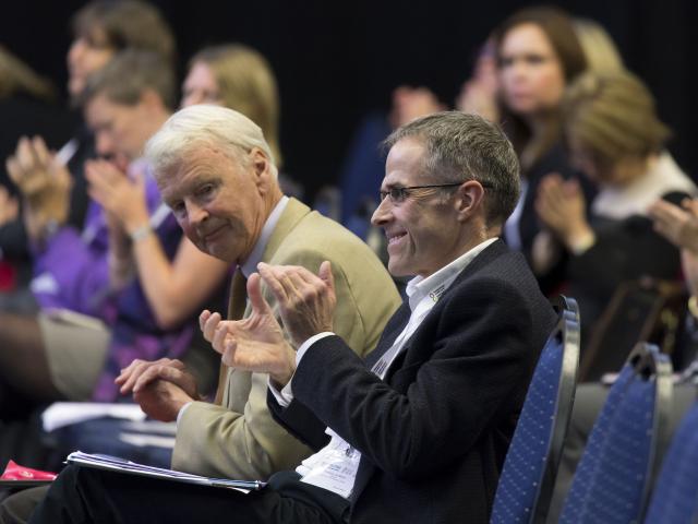 man clapping at event