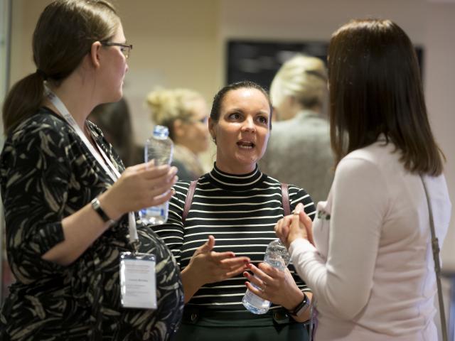 Women chatting at event