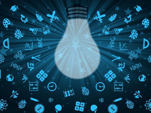 Image of light bulb with lots of symbols representing learning