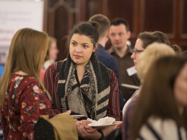 People chatting at an event