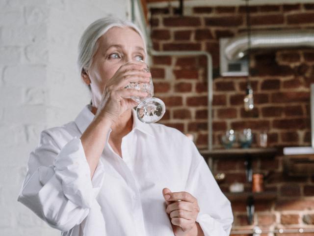 Older lady drinking water