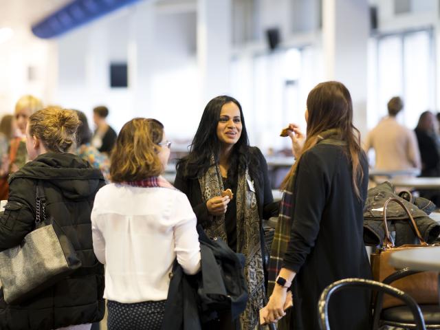 People chatting at event