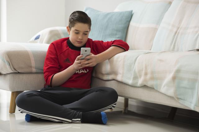 Boy looking at phone