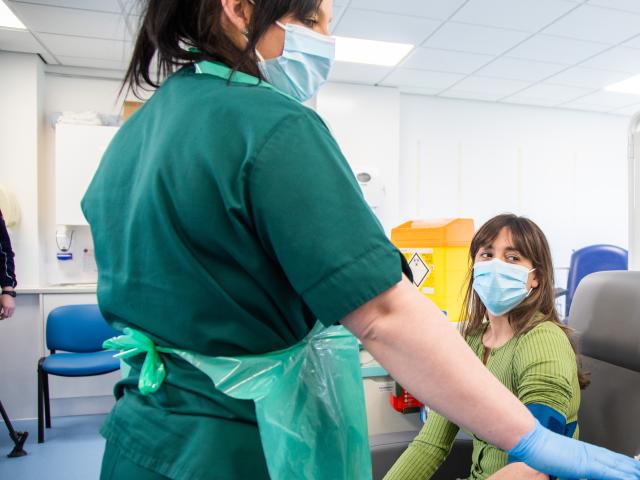 A nurse attending to the a patient in a hospital.