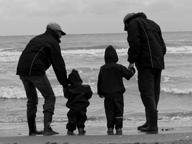 A family on a beach.
