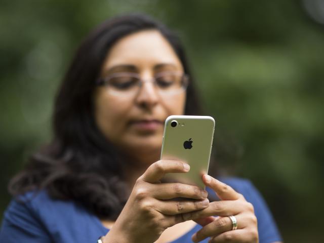 A woman looking at her phone.