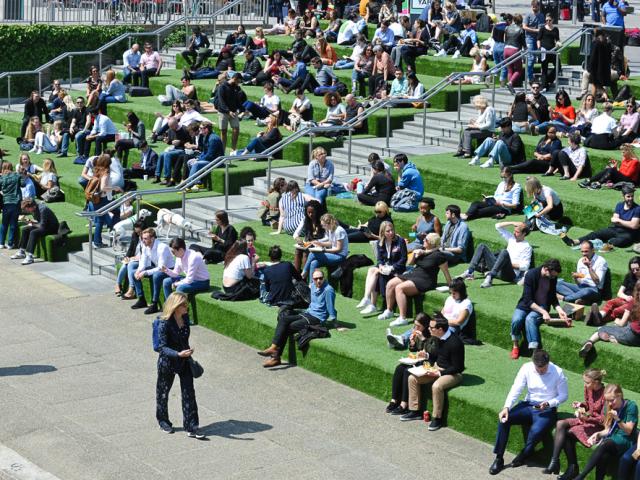 People sitting outside on steps