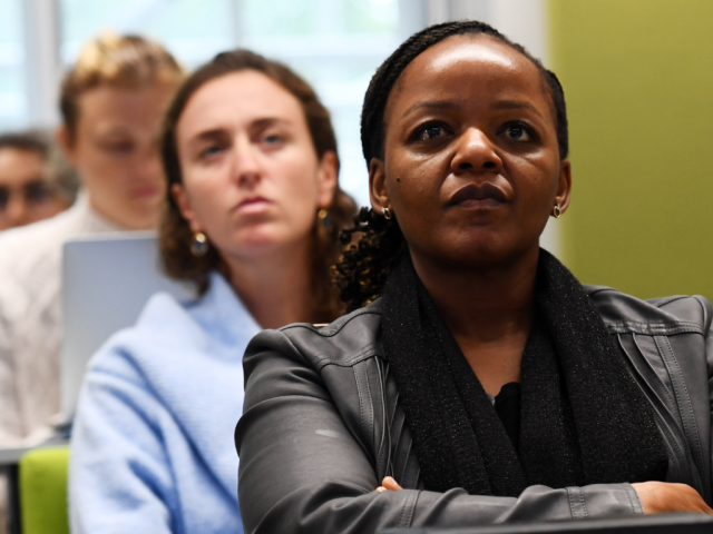 Two women in a training course looking at lecturer