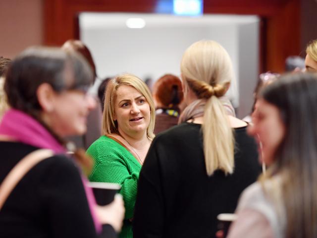 Conference attendees chatting