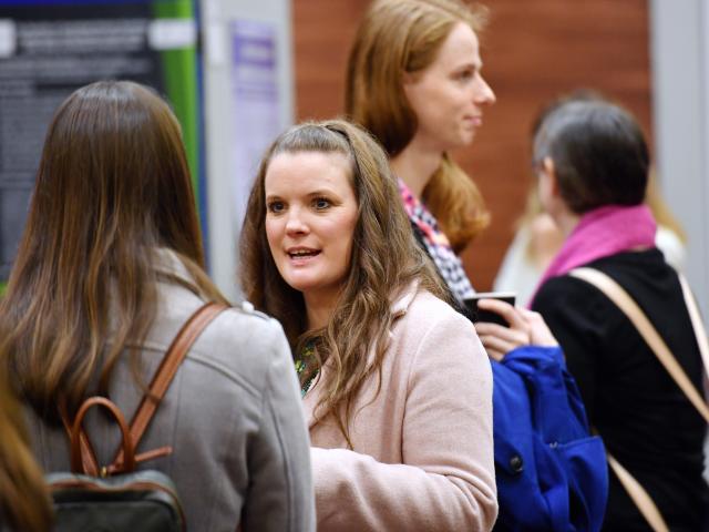 Female attendees talking