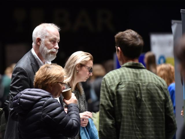 Delegates talk at an exhibition