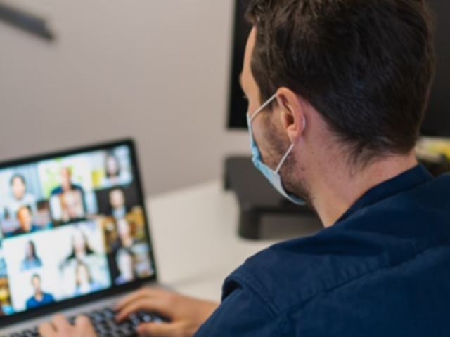 Nurse using a laptop on a zoom call