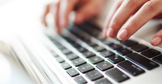 Fingers typing on a keyboard