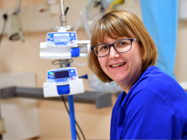 Nurse smiling at the camera. 