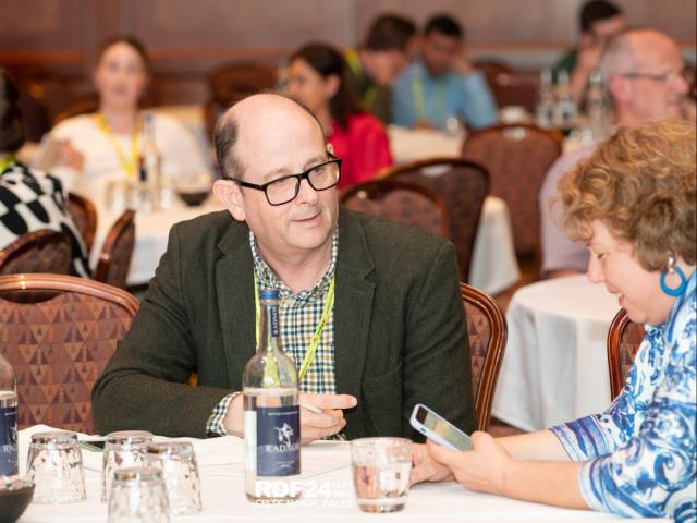 People talking at a conference