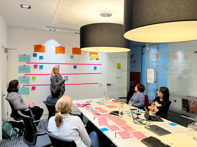 Researchers and public co-designing in a room.