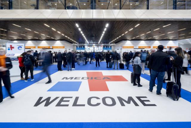 Entracne to MEDICA with people gathering