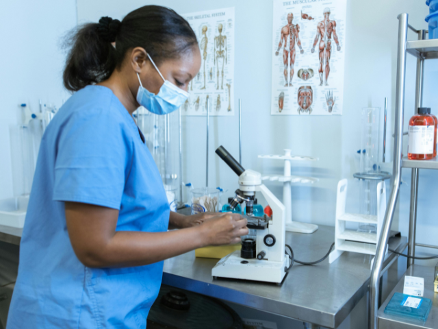 Black female scientist in a lab. 