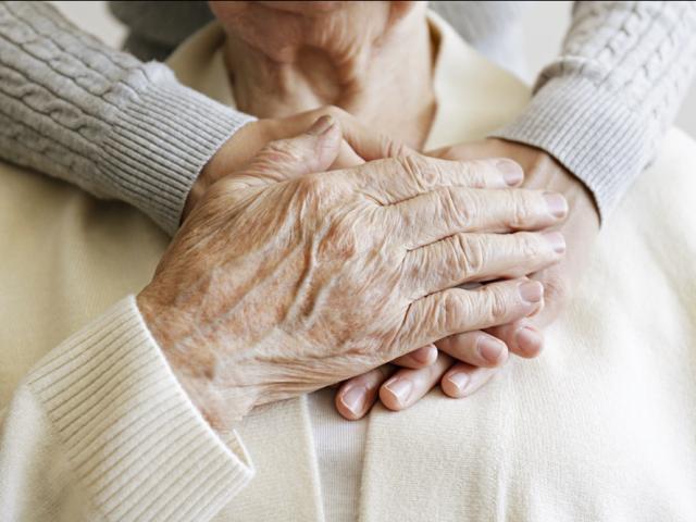 Old couple hugging