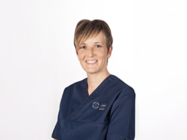 A headshot of nurse Emma in her uniform.