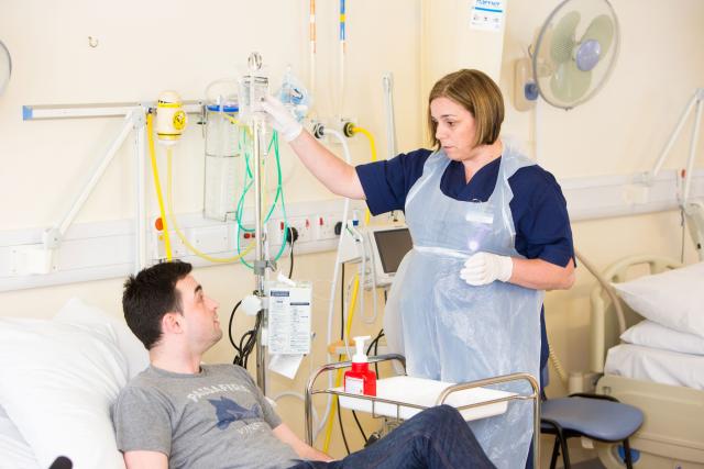 a nurse taking care of a patient