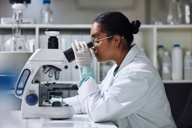 Woman at microscope