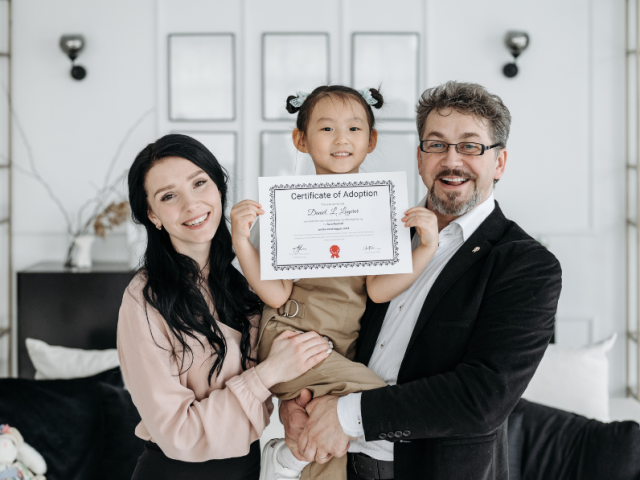 Adopted child with new parents.
