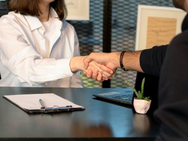 two_people_shake_hands