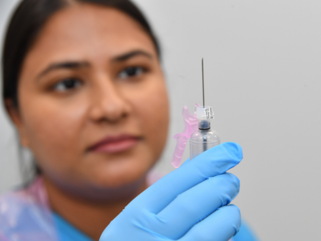 Nurse holding a vaccine close up