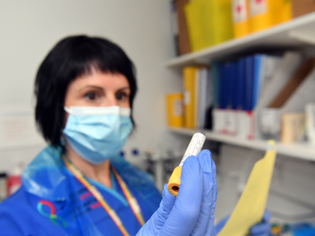 Nurse holding a test tube