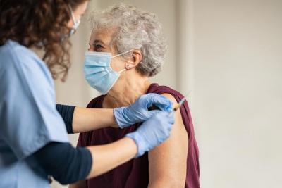 Lady receiving vaccine
