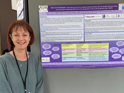 A headshot of Esther Goodhew presenting a poster. 