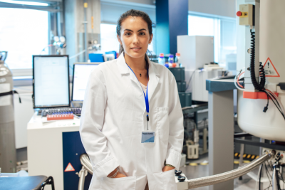 Female researcher stood in lab