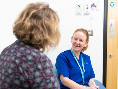 Two women discussing health and care research