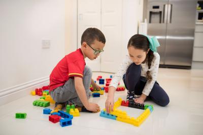 two children playing at home