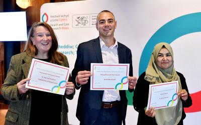 Julia Hiscock, Dave Bosanquet, Ashra Khanon with award certificates