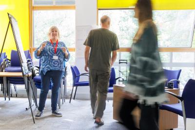 Woman with group of people learning