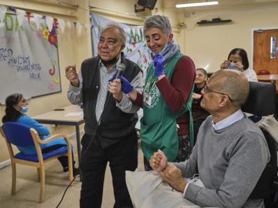 Nurse with care home residents. 