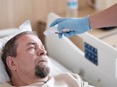 man in hospital bed