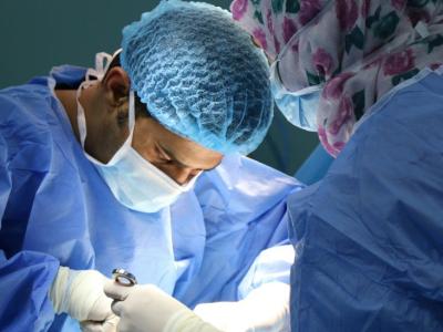 two_clinicians_performing_surgery