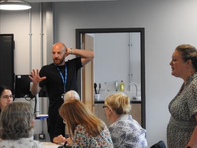 Group of people talking in workshop 