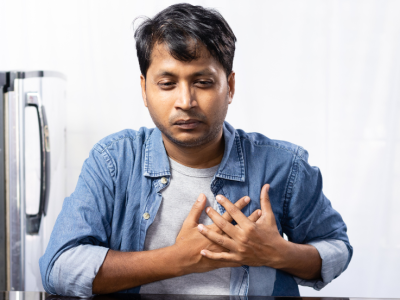 person holding chest in pain
