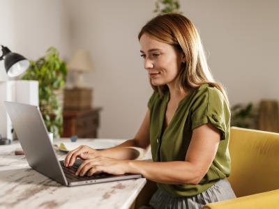 woman typing at laptop